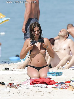 Foto Voyeur esibizioniste in spiaggia