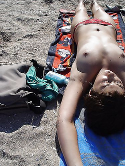 Foto Voyeur esibizioniste in spiaggia