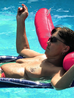 Mature wife naked in the pool