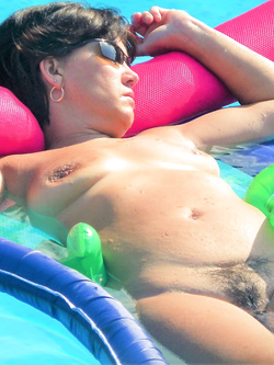 Mature wife naked in the pool