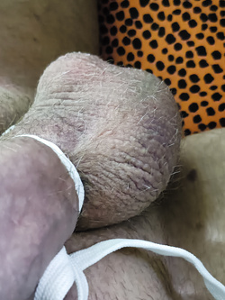 Huge cock tied very tightly with a rope